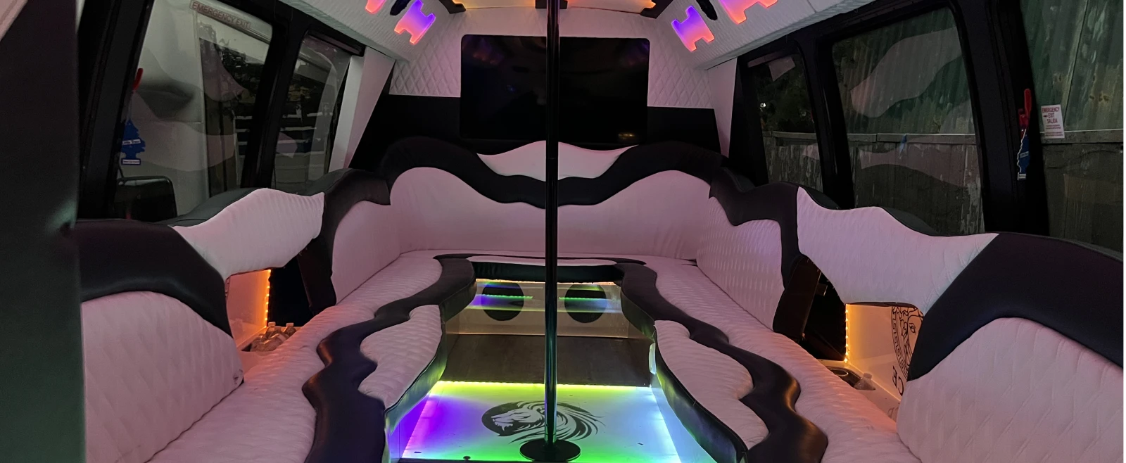 Party Bus Rental Chicago | IQ Limousine Skokie | Call Now 11 Full-width luxury party bus interior with LED lighting, leather seating, and bar area